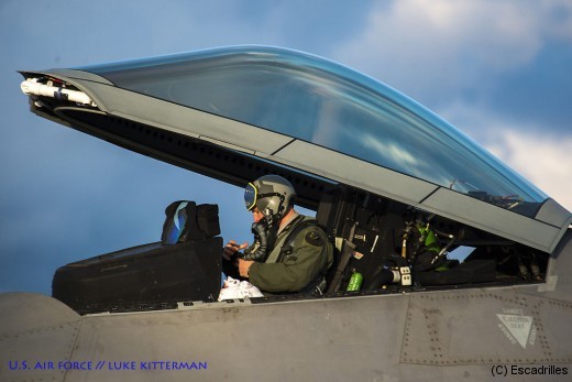 An F-22 Raptor fighter aircraft pilot assigned to the 95th Fighter Squadron at Tyndall Air Force Base, Fla., prepares to exit an F-22 at Spangdahlem Air Base, Germany, Aug. 28, 2015. The U.S. Air Force deployed four F-22 Raptors, one C-17 Globemaster III and more than 50 Airmen to Spangdahlem in support of the first F-22 European training deployment. The inaugural F-22 training deployment to Europe is funded by the European Reassurance Initiative, a $1 billion pledge announced by President Obama in March 2014.(U.S. Air Force photo by Airman 1st Class Luke Kitterman/Released)